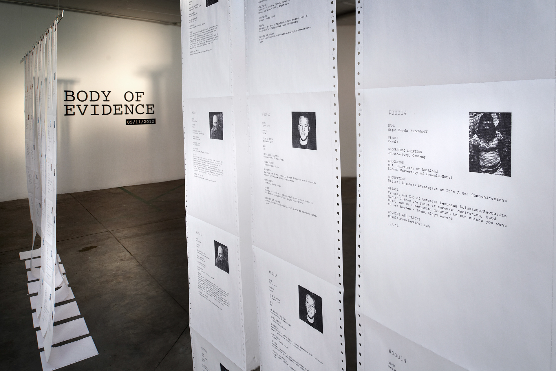 Body of Evidence installation with long suspended dot-matrix profiles filling a gallery