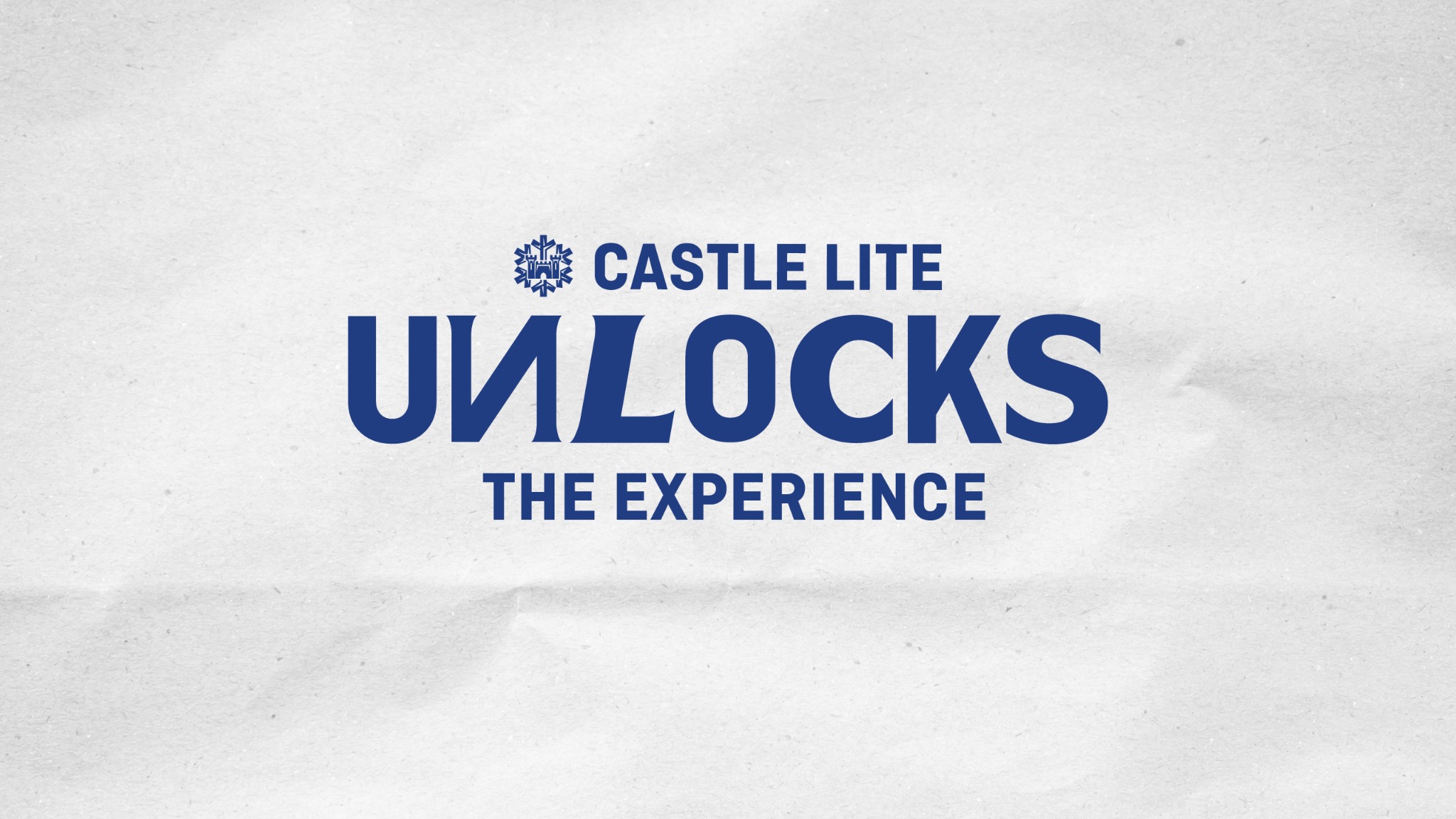 Castle Lite Unlocks — typographic campaign identity on tactile white paper