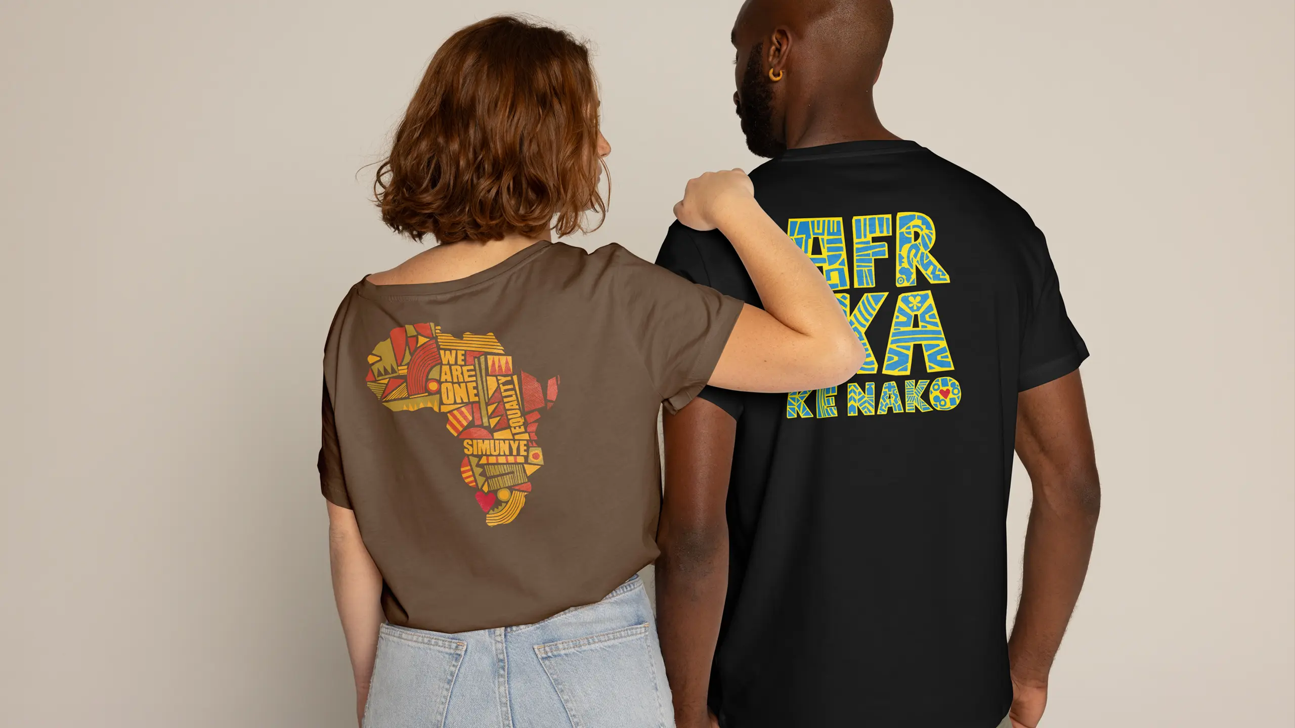 Two models wearing the updated Goodbye Malaria campaign tees, one bearing the illustrated Africa graphic and the other AFRIKA KE RAKO