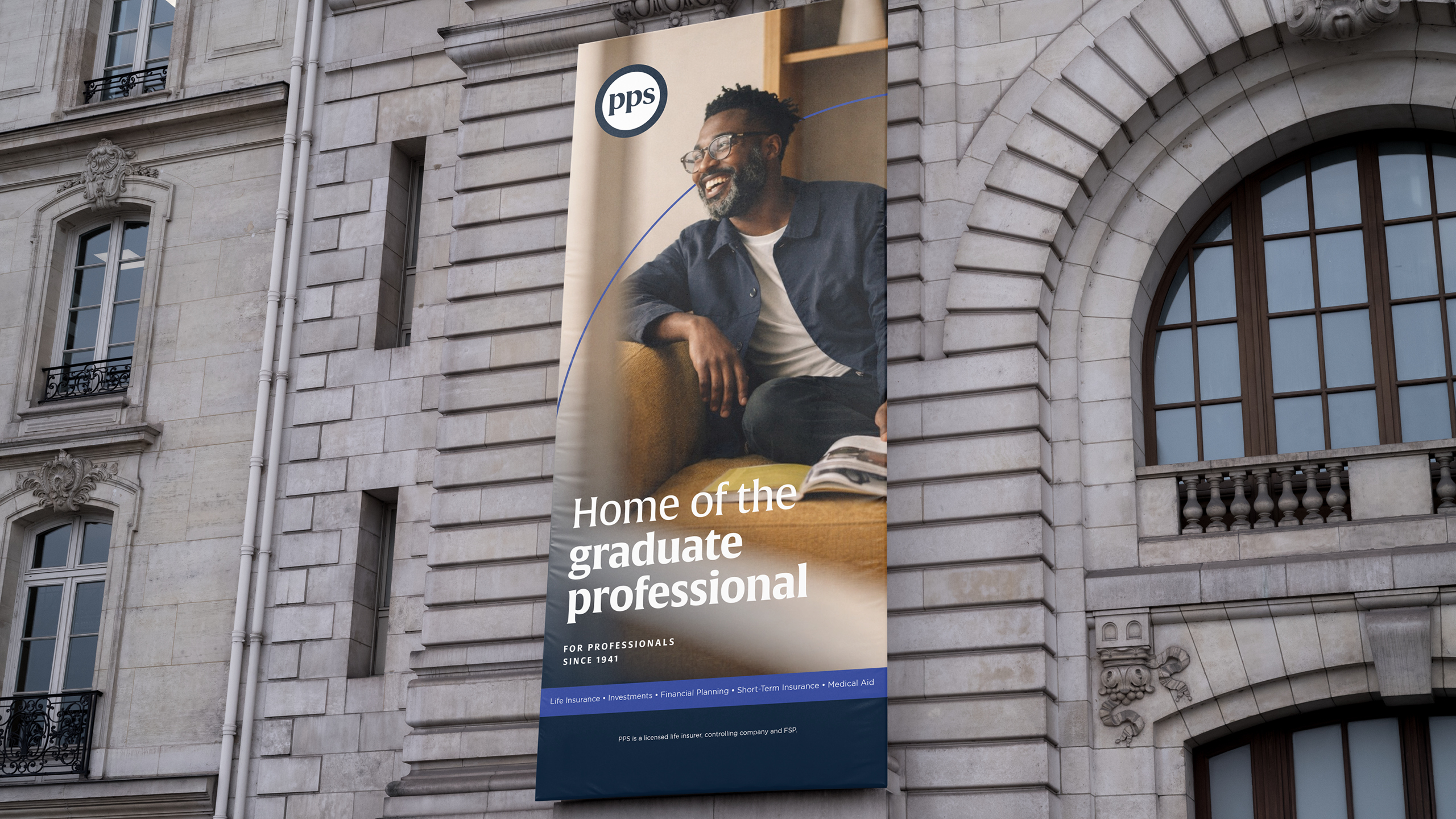 PPS outdoor banner at a contemporary office building with the line Home of the graduate professional