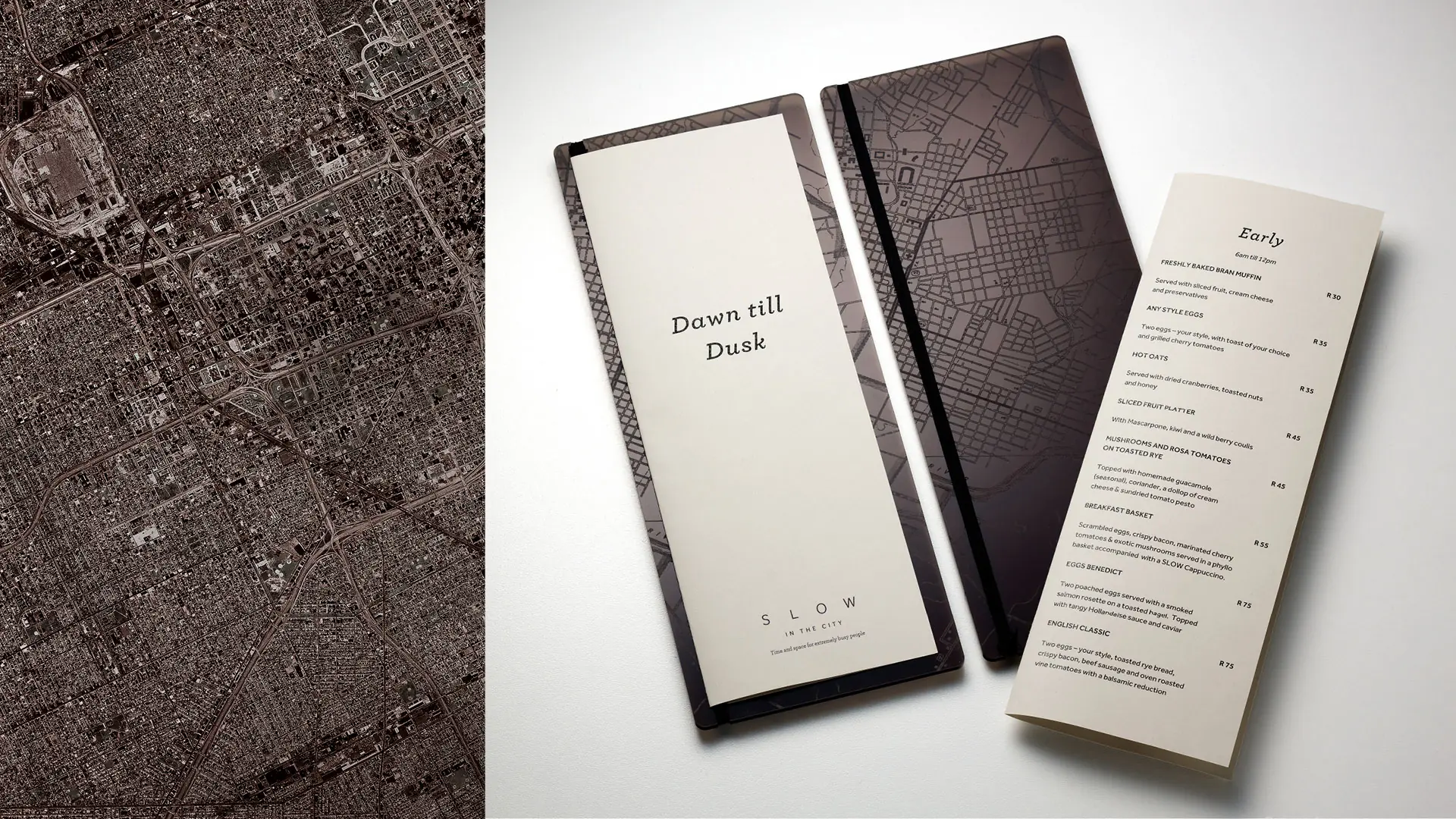 SLOW in the City menu, bill folder and city-map textures arranged on a pale surface